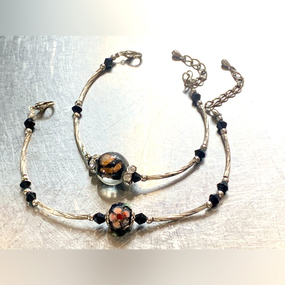 Two black Cloisonne bead, silver, and rhinestone bracelets.